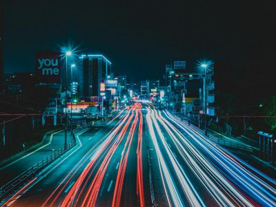 Blurred motion of a person running in the night city.