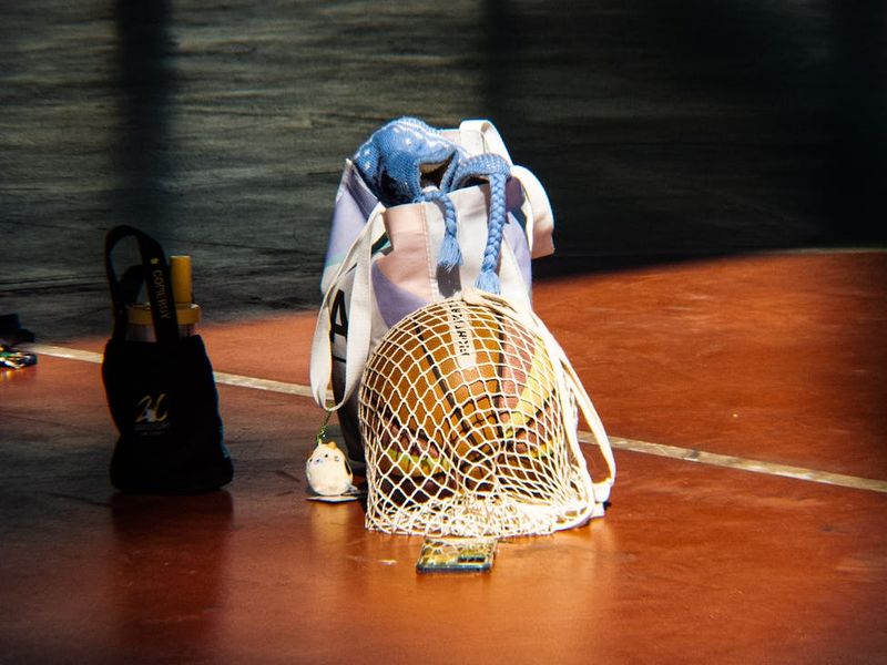 Close up of sports equipment in a dark minimal room.